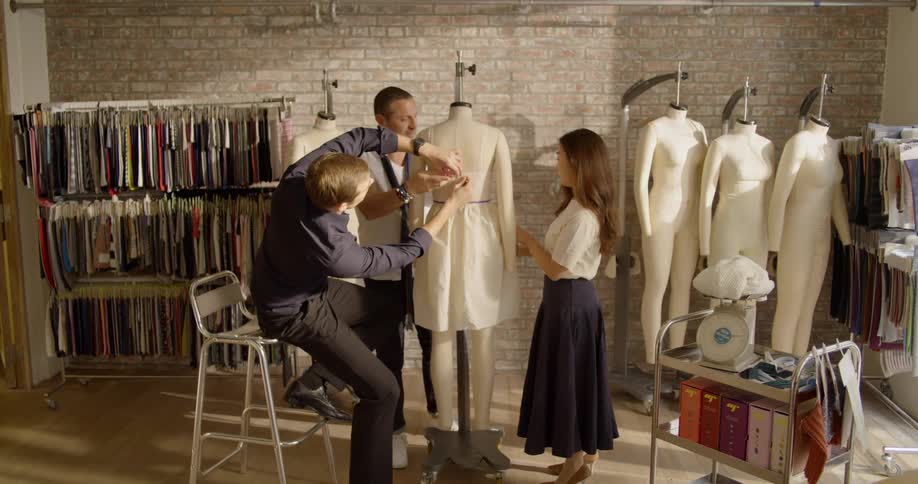 People use a mannequin to tailor a dress