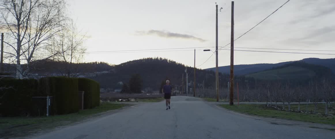 A man jogs down the road