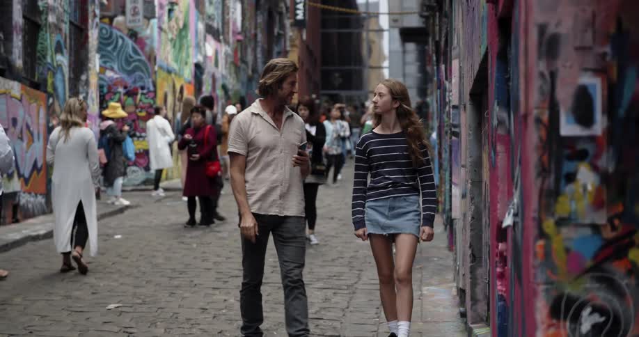 Pedestrians walk in a city alley