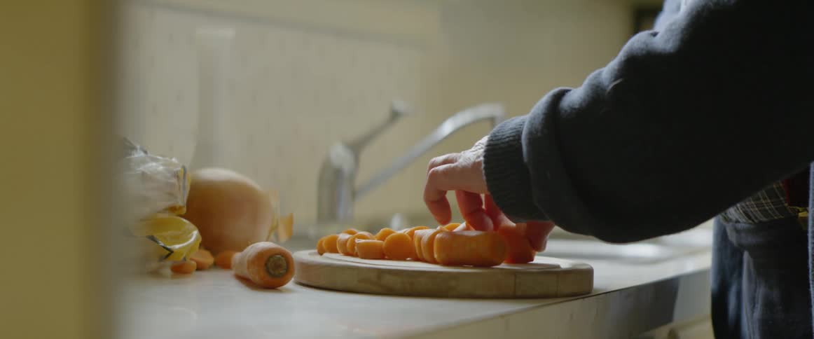 A carrot is sliced on a cutting board