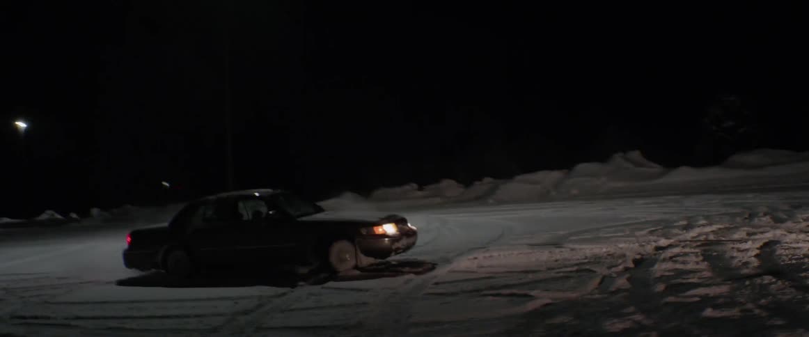 Car spins cookies in a snowy parking lot
