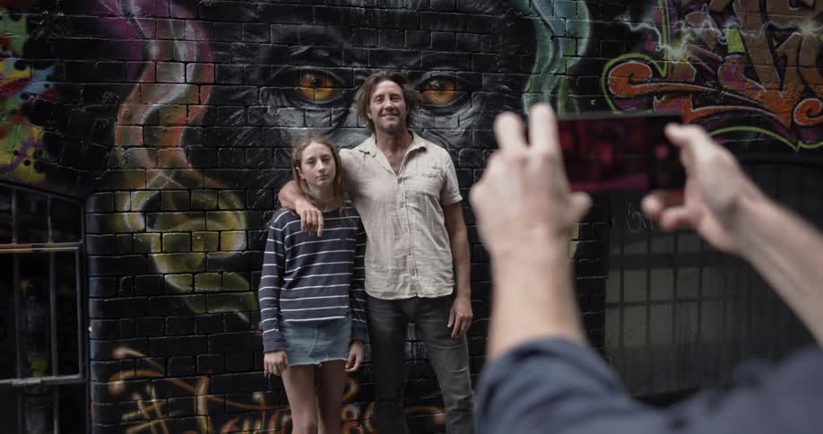 A man and child have their photograph taken