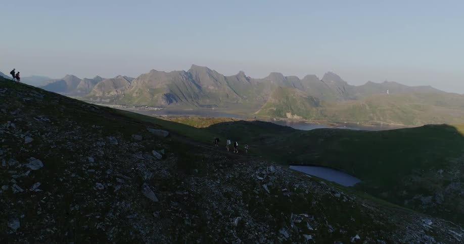 Mountains sit tall under a blue sky