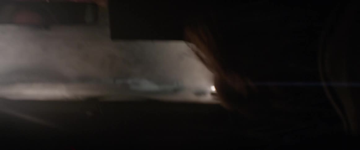 Man shakes his head forcefully as he sits in a vehicle