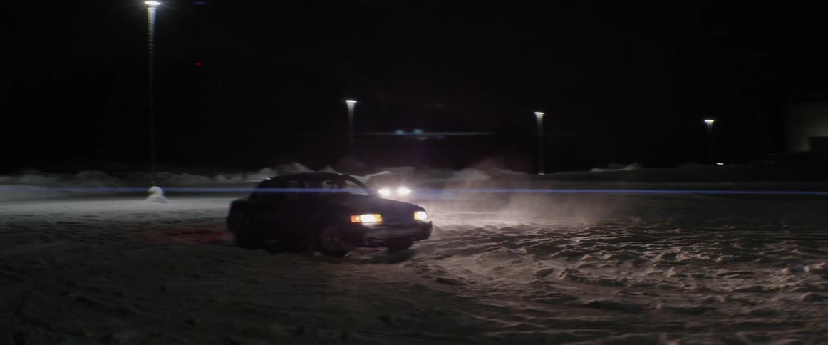 A car spins cookies in a snowy parking lot