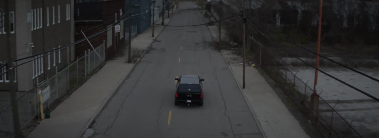 Car drives on a town street