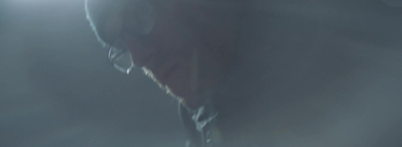 Man rubs wax on a snowboard