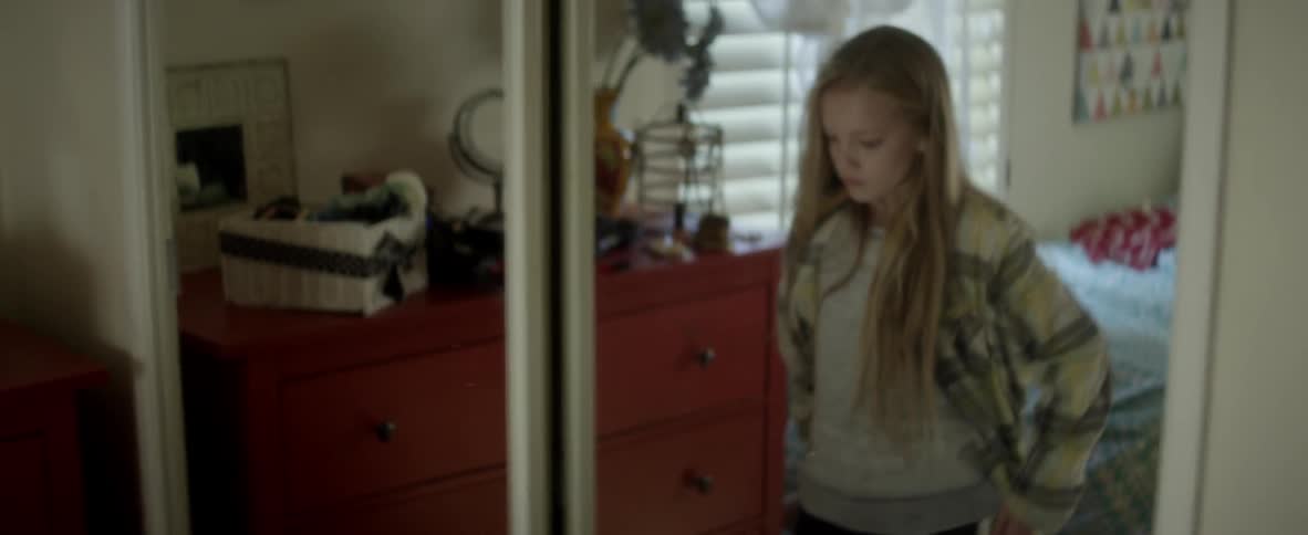 A child is throwing her belongings