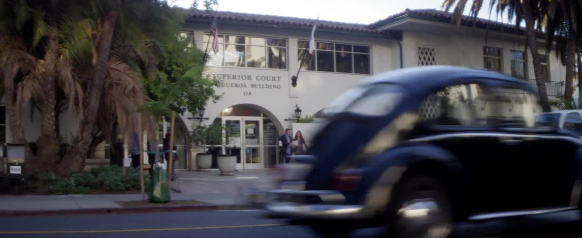 A woman is walking into court