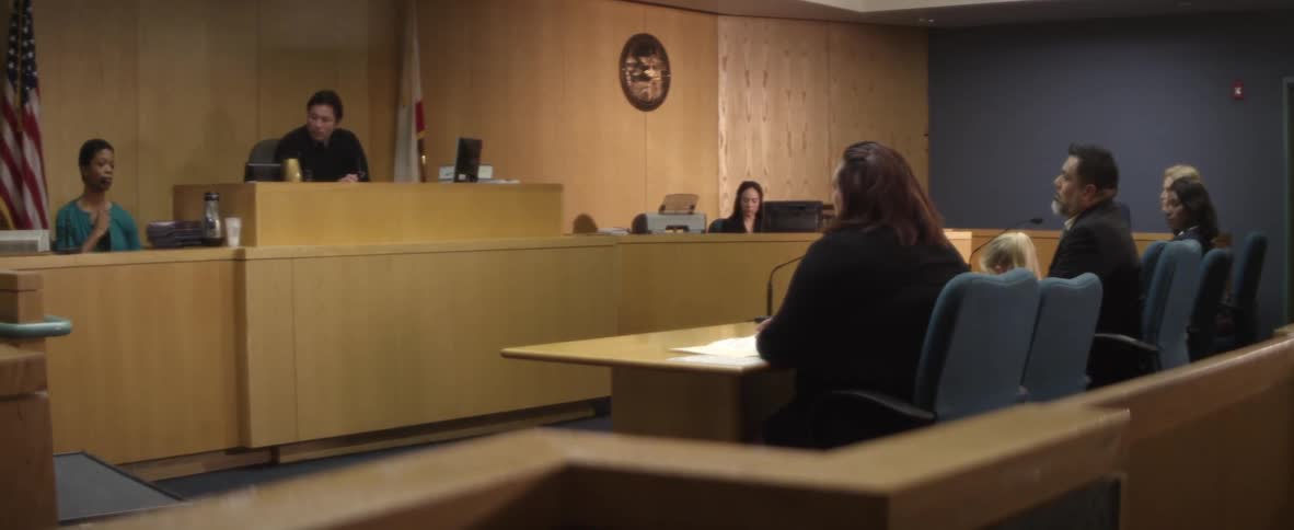 People are sitting in court