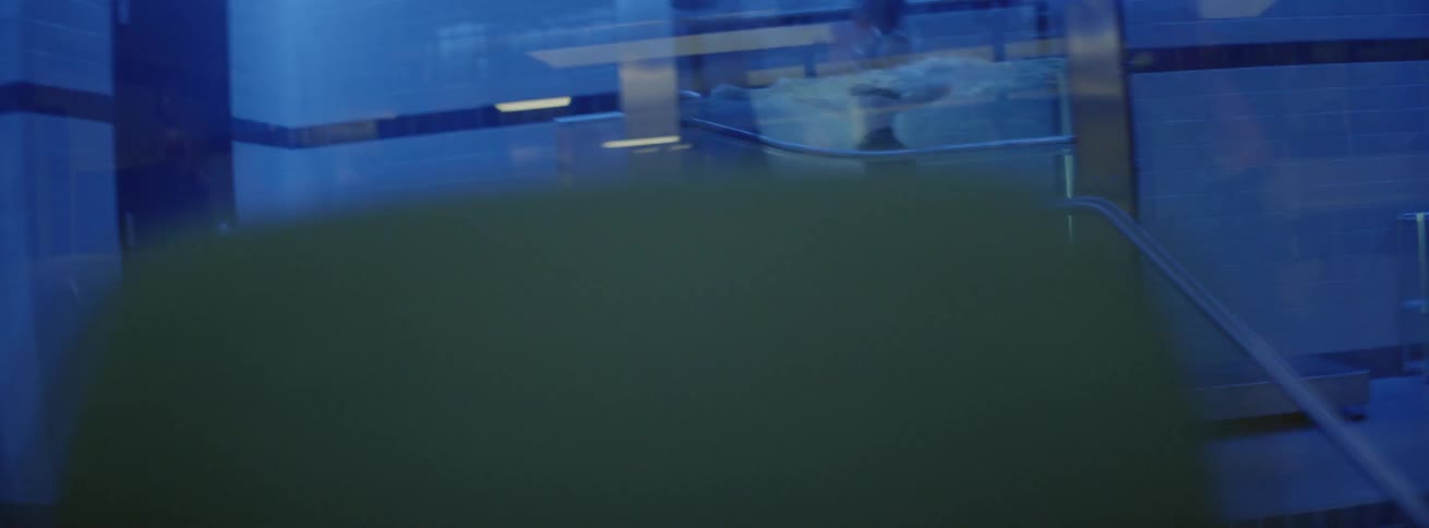 A woman running on a treadmill in a tank of water in a gym