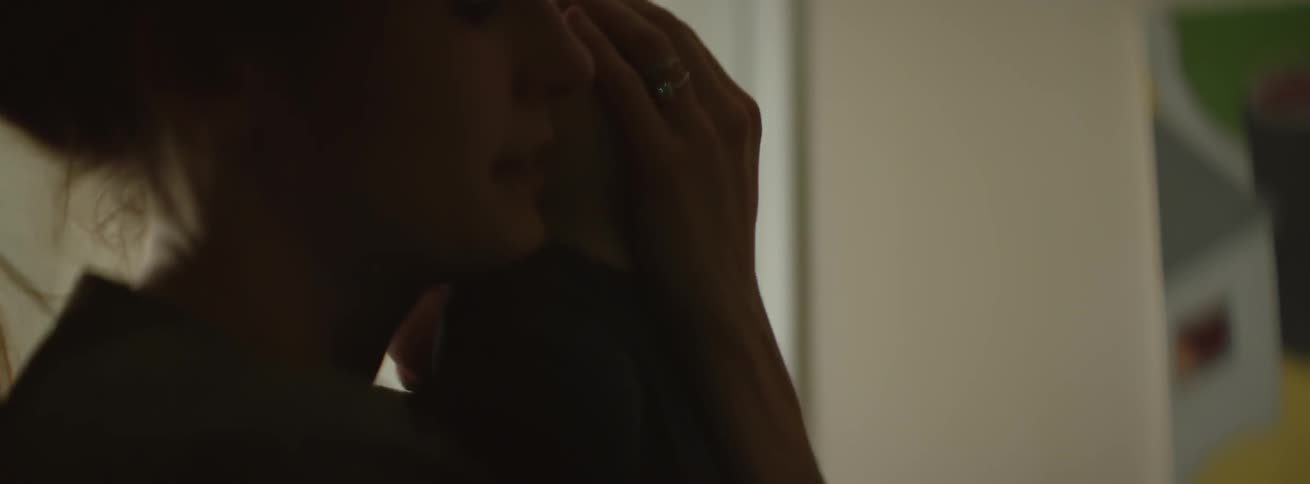 A woman soothes a baby