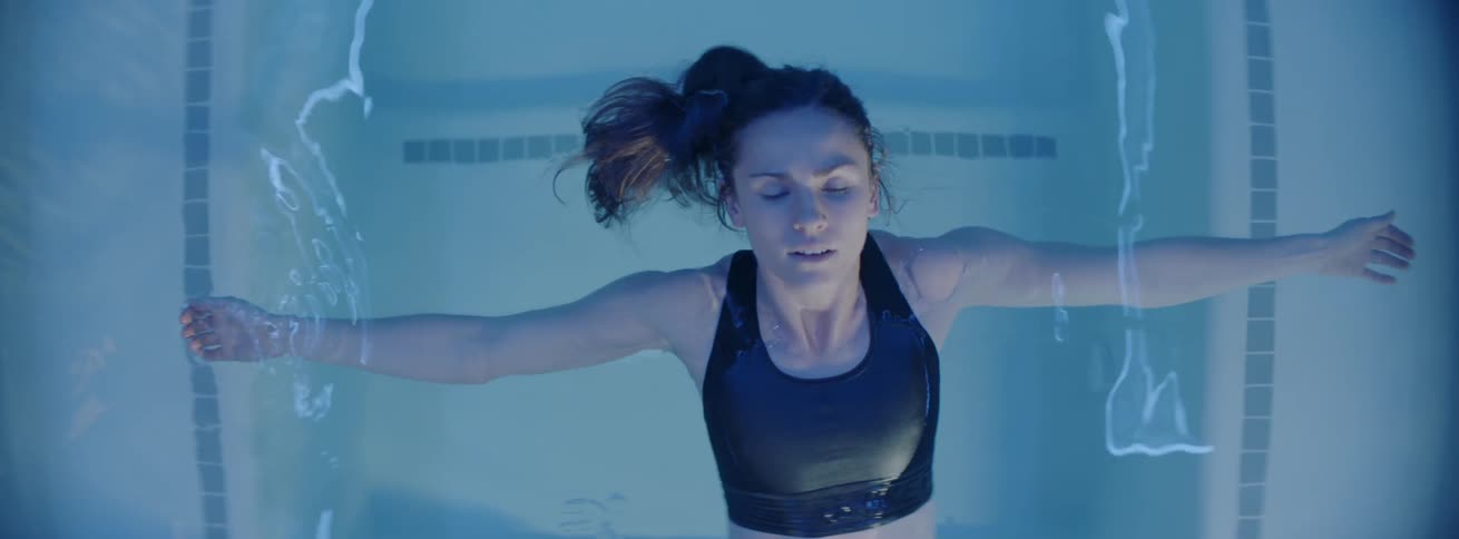 A woman floats on the water