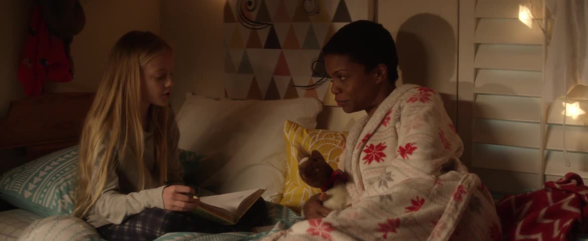 A child reading to an adult