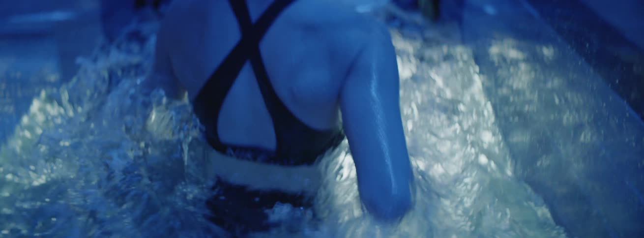 Woman runs on an underwater treadmill