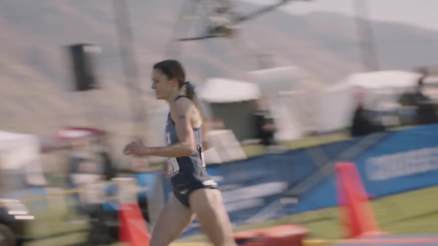 A female athlete completes a track event