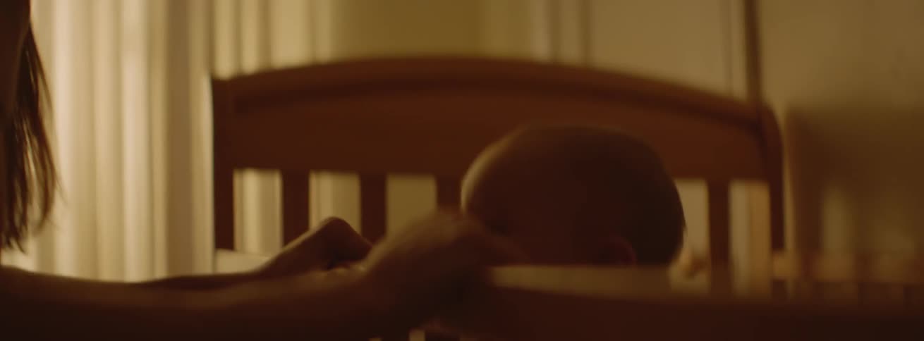 Baby bounces in a crib