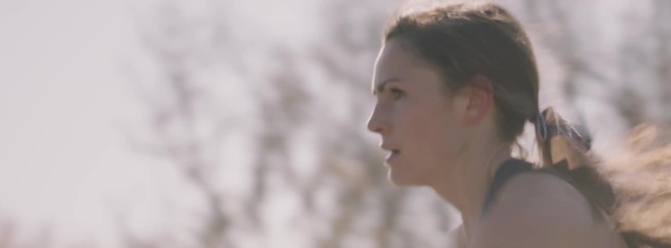 Woman runs in an outdoor race