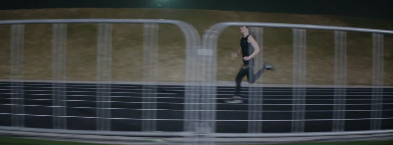 The woman races on the running track