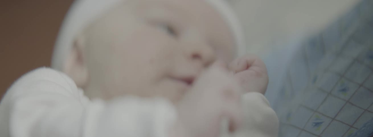Woman holds a newborn baby