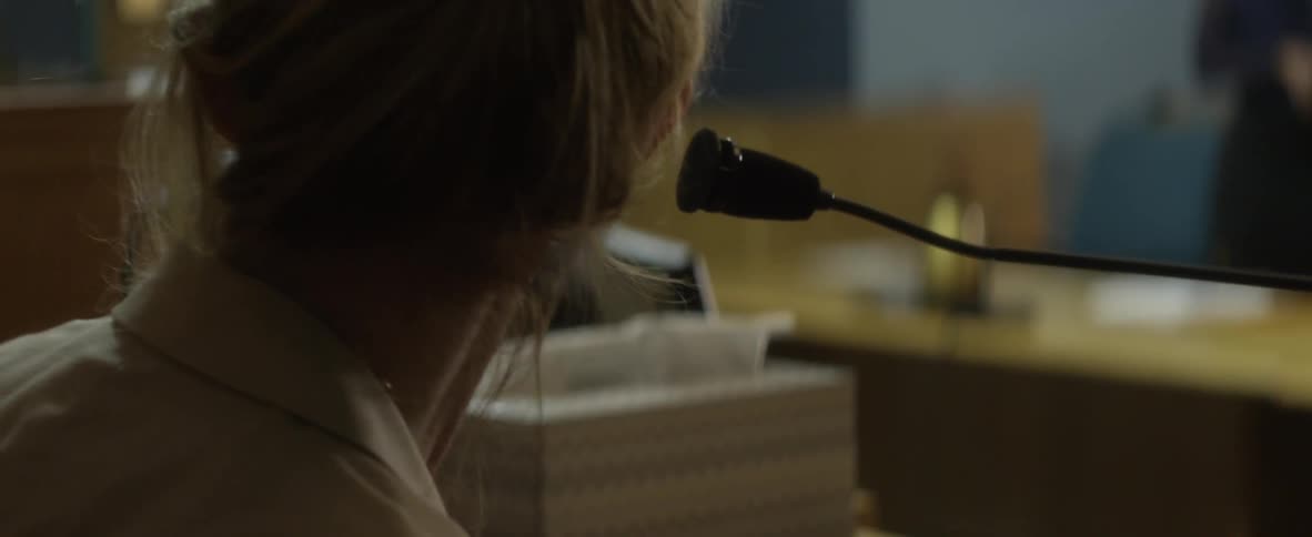A woman is speaking in court