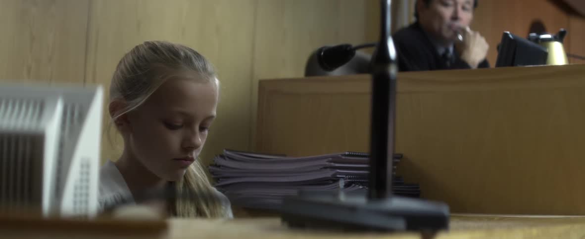 A child sits in court
