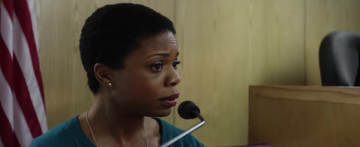 A woman is speaking in court