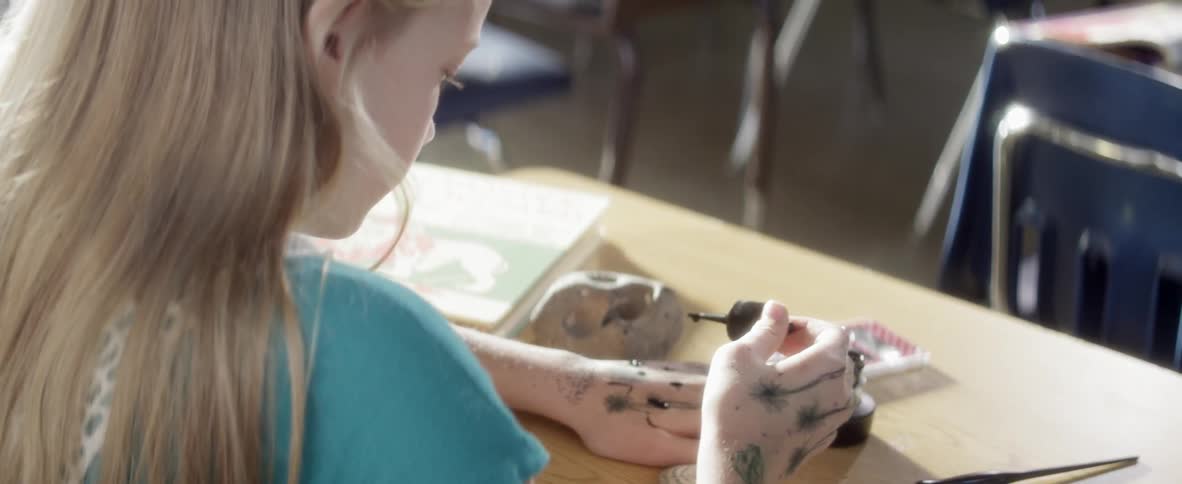 Woman drops paint on her hands