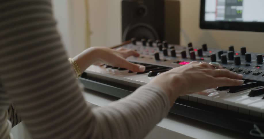 A person is playing the keyboard