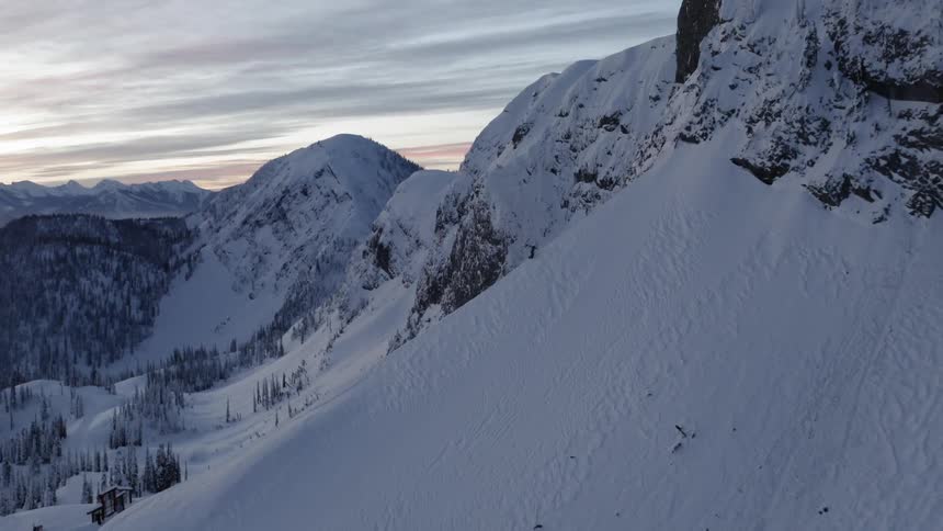 The hills filled with snow cover the mountains