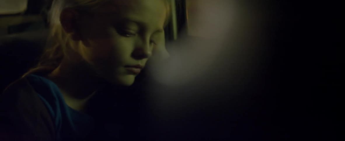 A child is riding in the bus