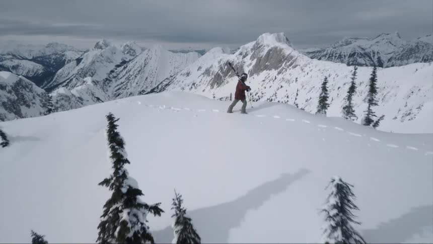 The hills are covered with snow and trees
