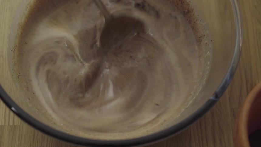 A person mixing something with a spoon