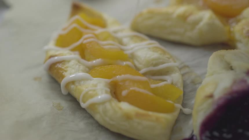 A person decorating pastries