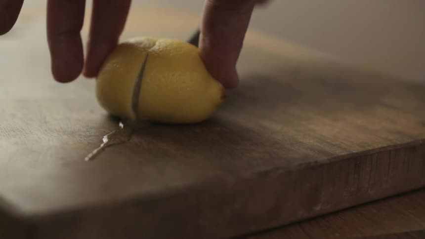 Lemon being sliced in half