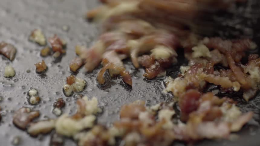 Food is being fried in a pan