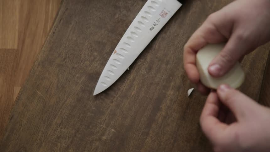 Onion being cut and peeled