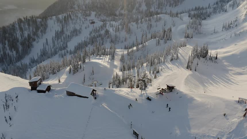 Sun shines over snowy mountains