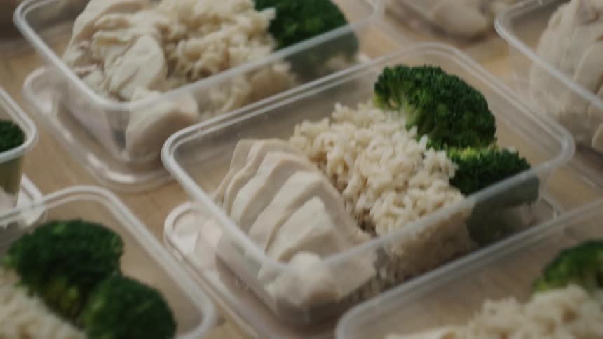 Large number of prepared meals in plastic dishes