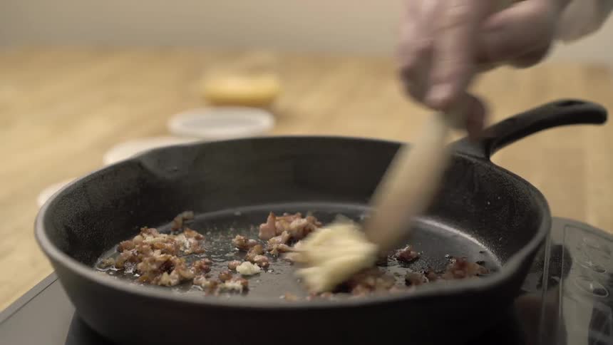 Person cooking on an iron pan