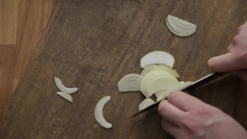 Someone is chopping an onion