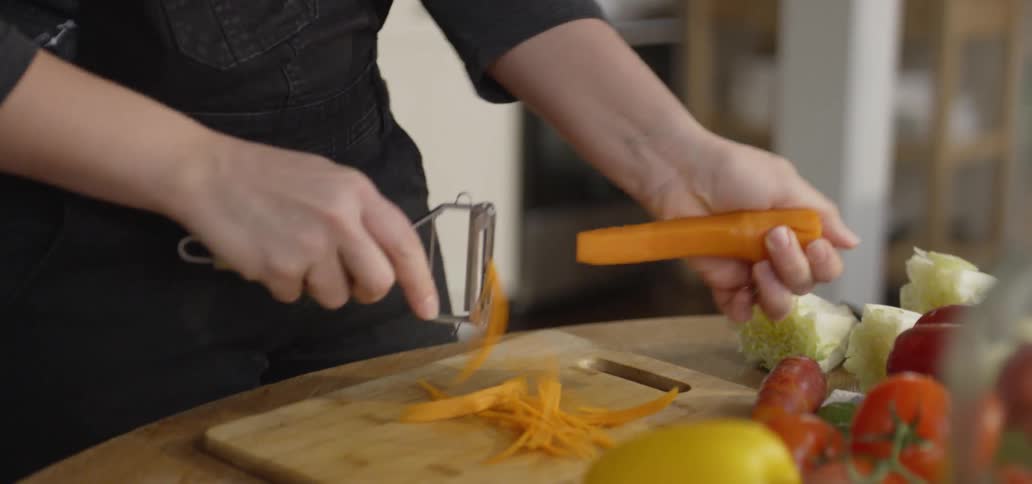 Man peels a carrot