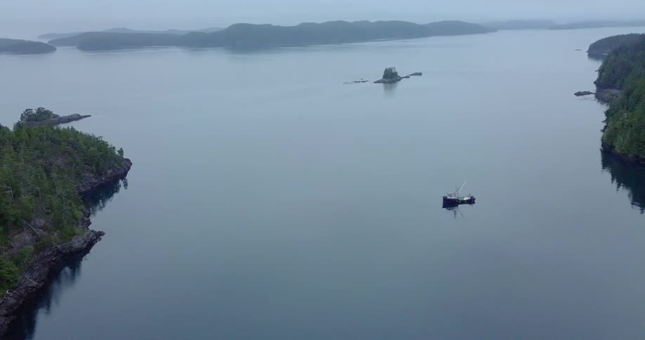 A boat is sailing in the lake below