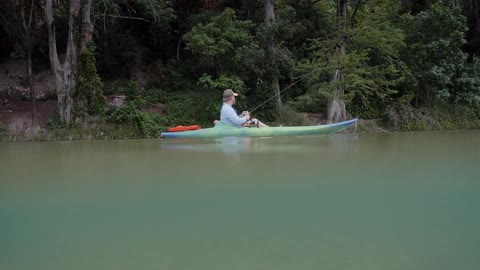 Man fishes from a kayak