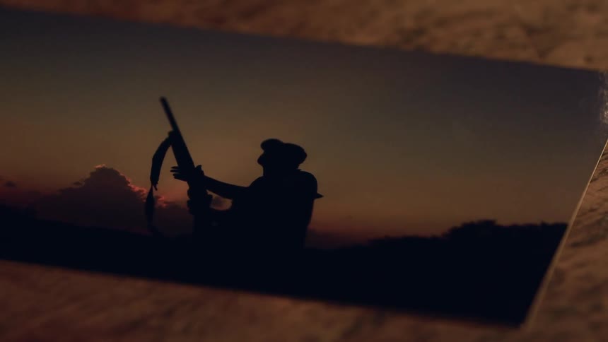 Picture of a person holding a gun