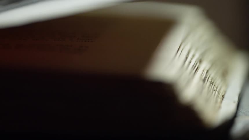 The large book is open on the table