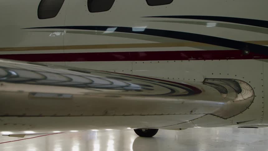 An airplane parked in a hangar