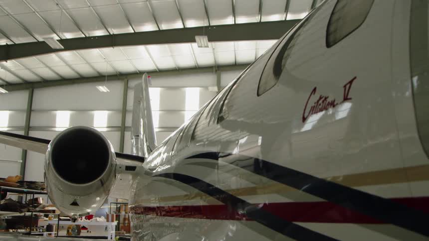 An airplane parked in a hangar