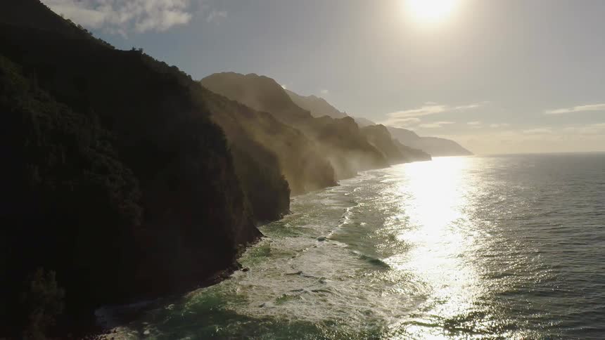 The sun shines on the flowing ocean waters