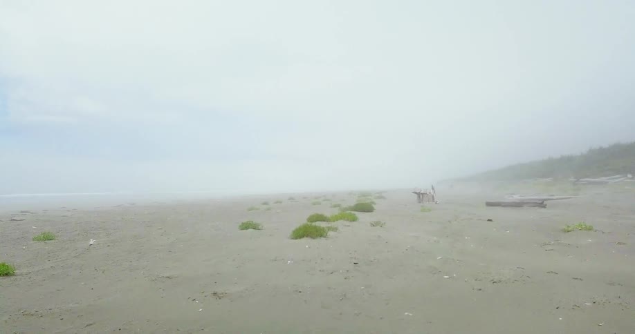 Water flowing near a sandy beach